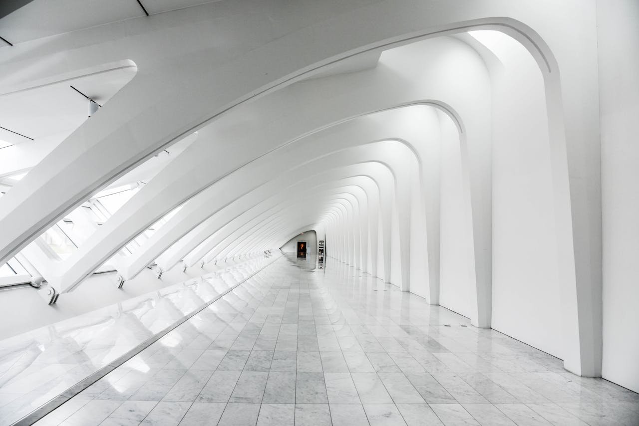 Explore the sweeping modern arches and minimalistic design of the Milwaukee Art Museums white hallway.
